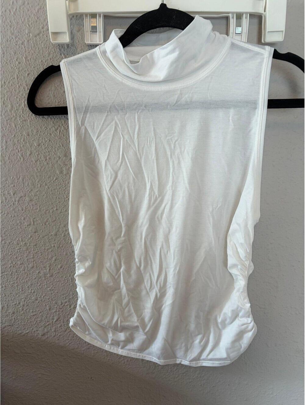 Lululemon white turtle neck ruched tank. Best for a 4. Armpits are discolored.